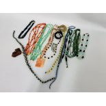 A BOX OF ASSORTED VINTAGE GLASS BEADED NECKLACES ALONG WITH AN UNUSUAL HARDSTONE HANDMADE NECKLACE