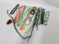 A BOX OF ASSORTED VINTAGE GLASS BEADED NECKLACES ALONG WITH AN UNUSUAL HARDSTONE HANDMADE NECKLACE