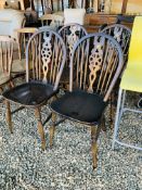 A SET OF FOUR TRADITIONAL WHEEL BACK KITCHEN CHAIRS