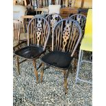 A SET OF FOUR TRADITIONAL WHEEL BACK KITCHEN CHAIRS