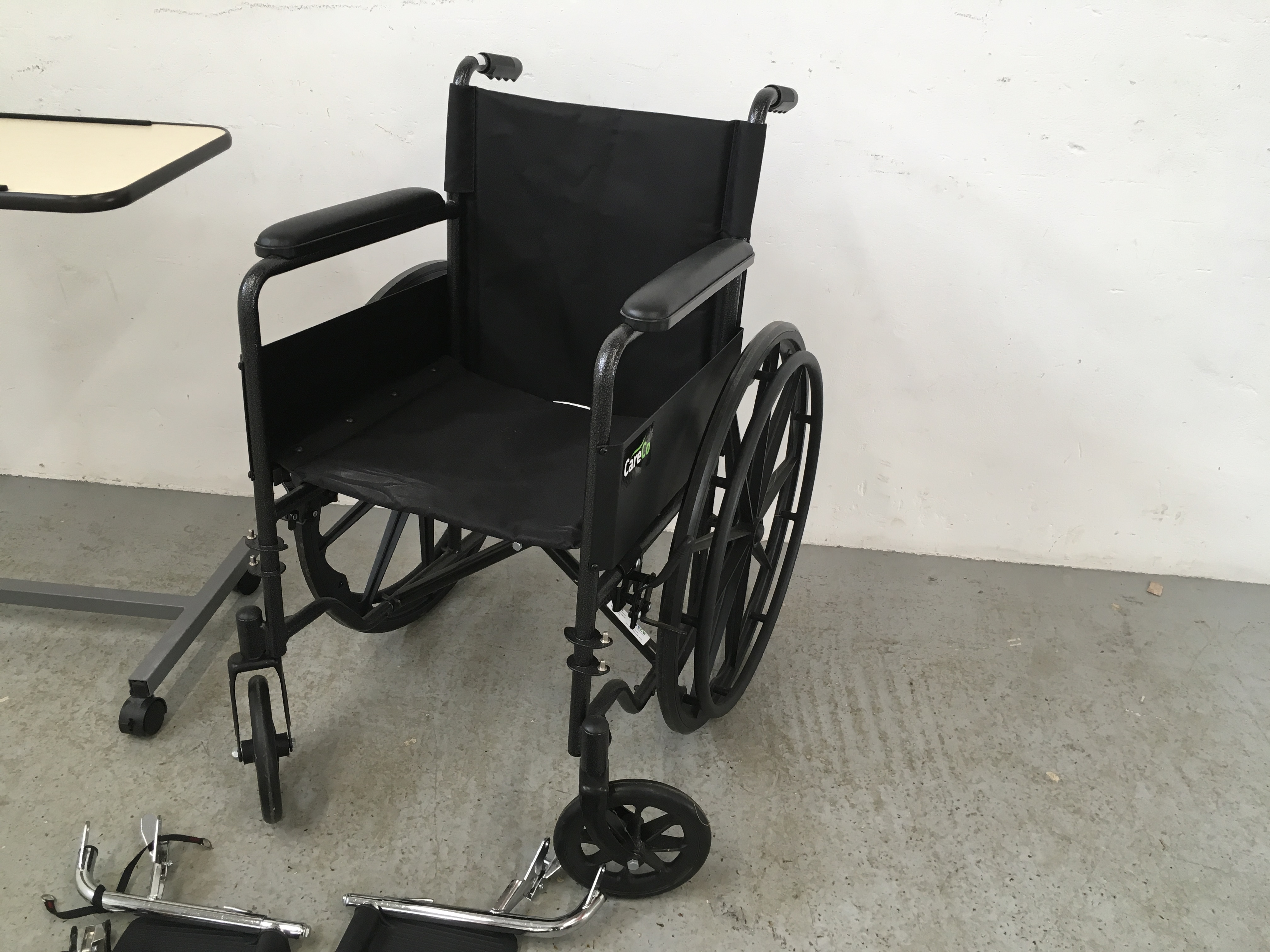 CARE CO WHEEL CHAIR AND FOOT RESTS ALONG WITH A WHEELED BED TRAY - Image 3 of 9