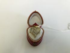 A 9CT GOLD HEART PENDANT SET WITH MULTIPLE DIAMONDS