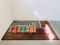 LARGE ORIENTAL PATTERNED RUG ON A RED BACKGROUND 235CM. X 170CM.