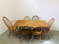 AN ERCOL BLONDE FINISH RECTANGULAR DINING TABLE W 76CM. L 152CM.