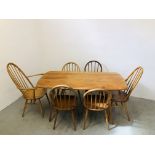 AN ERCOL BLONDE FINISH RECTANGULAR DINING TABLE W 76CM. L 152CM.