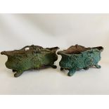 A PAIR OF DECORATIVE CAST IRON BOAT SHAPE PLANTERS