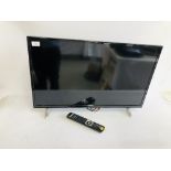 A HITACHI 32 INCH TELEVISION COMPLETE WITH REMOTE - SOLD AS SEEN