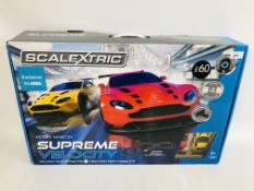 A BOXED SCALEXTRIC ASTON MARTIN SUPREME VELOCITY RACING GAME