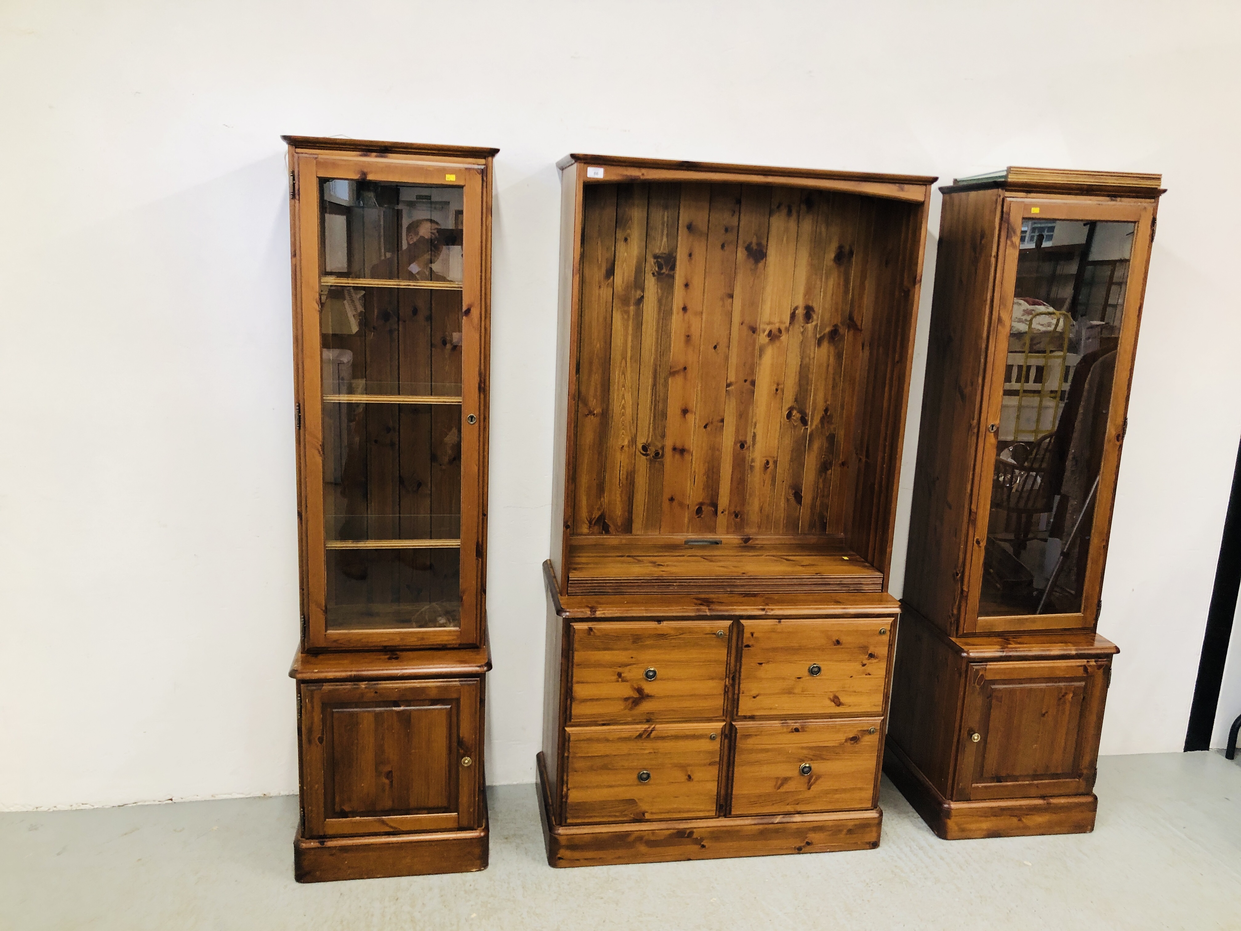 A PAIR OF DUCAL HONEY PINE GLAZED CABINETS WITH CABINET BASES EACH W 51CM. D 44CM. H 89CM. - Image 3 of 12