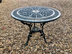 A DECORATIVE CAST METAL PATIO TABLE - TOP DIAMETER 80CM