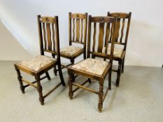 A SET OF FOUR 1940'S OAK DINING CHAIRS WITH SLAT BACK AND BULLSEYE DETAIL