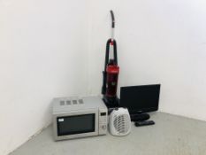 A TESCO MICROWAVE OVEN, A HOOVER WHIRLWIND UPRIGHT VACUUM CLEANER,
