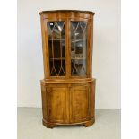 A QUALITY REPRODUCTION YEW FINISH HALF GLAZED CORNER CABINET - W 92CM. H 181CM.