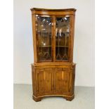 A QUALITY REPRODUCTION YEW FINISH CONCAVE HALF GLAZED FULL HEIGHT CORNER CABINET - W 92CM. H 180CM.