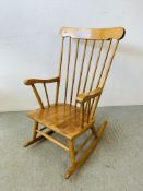 A MODERN BEECHWOOD STICK BACK ROCKING CHAIR