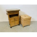 A BEECH WOOD KITCHEN WORK STATION WITH SOLID GRANTIE TOP ALONG WITH A BEECH WOOD LAUNDRY BOX.