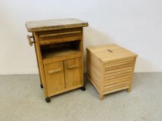 A BEECH WOOD KITCHEN WORK STATION WITH SOLID GRANTIE TOP ALONG WITH A BEECH WOOD LAUNDRY BOX.