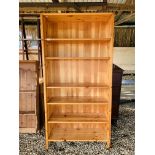 A MODERN HONEY PINE FULL HEIGHT SHELVING UNIT - W 89CM. D 31CM. H 178CM.