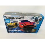 A BOXED SCALEXTRIC ASTON MARTIN SUPREME VELOCITY RACING GAME