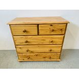 A MODERN HONEY PINE TWO OVER THREE CHEST OF DRAWERS - W 88CM. D 41CM. H 83CM.