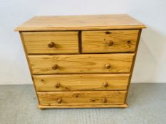 A MODERN HONEY PINE TWO OVER THREE CHEST OF DRAWERS - W 88CM. D 41CM. H 83CM.