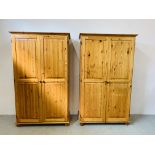 A PAIR OF MODERN HONEY PINE DOUBLE WARDROBES - EACH W 107CM. D 51CM.