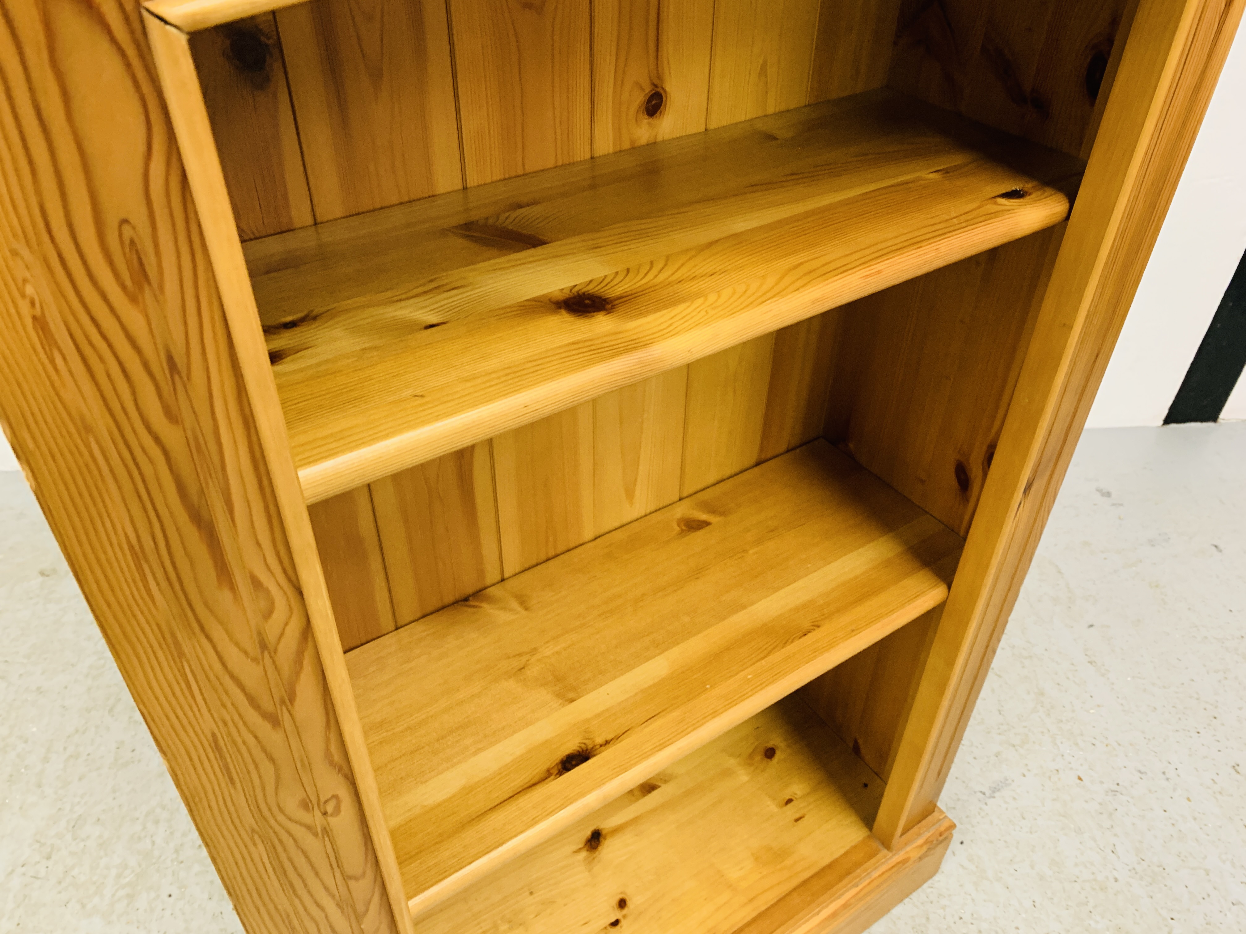 A SOLID HONEY PINE BOOKSHELF WITH TONGUE AND GROOVE BOARDED BACK - W 66CM. D 26CM. H 107CM. - Image 3 of 5