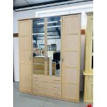 A LARGE MODERN BEECHWOOD FINISH COMBINATION WARDROBE,