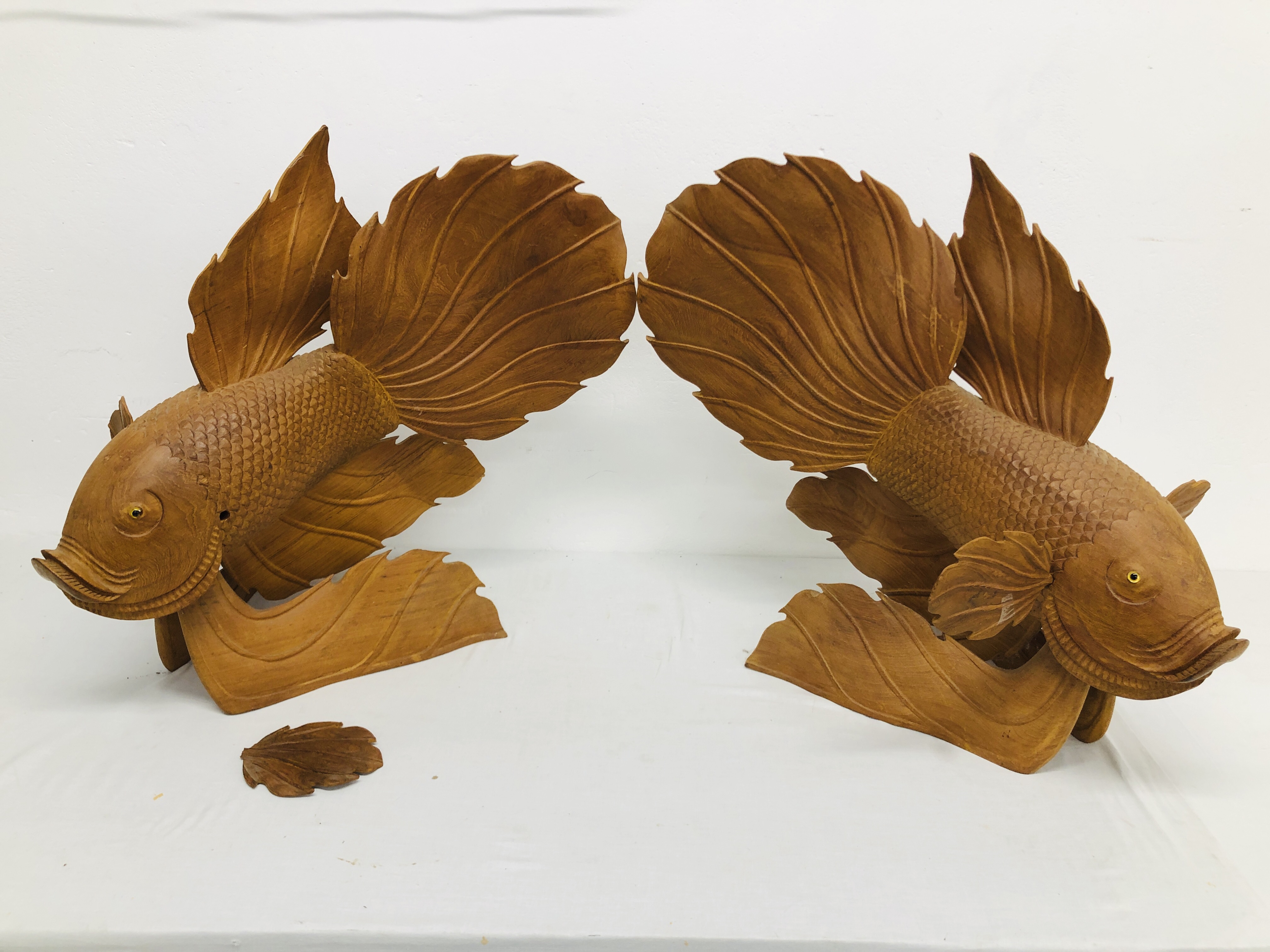 2 X LARGE CARVED TEAK WOOD FISH ORNAMENTS - EACH HEIGHT 58CM. LENGTH 65CM.