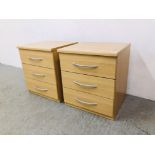 A PAIR OF MODERN BEECHWOOD FINISH THREE DRAWER BEDSIDE CHESTS - W 49CM. D 43CM. H 55CM.