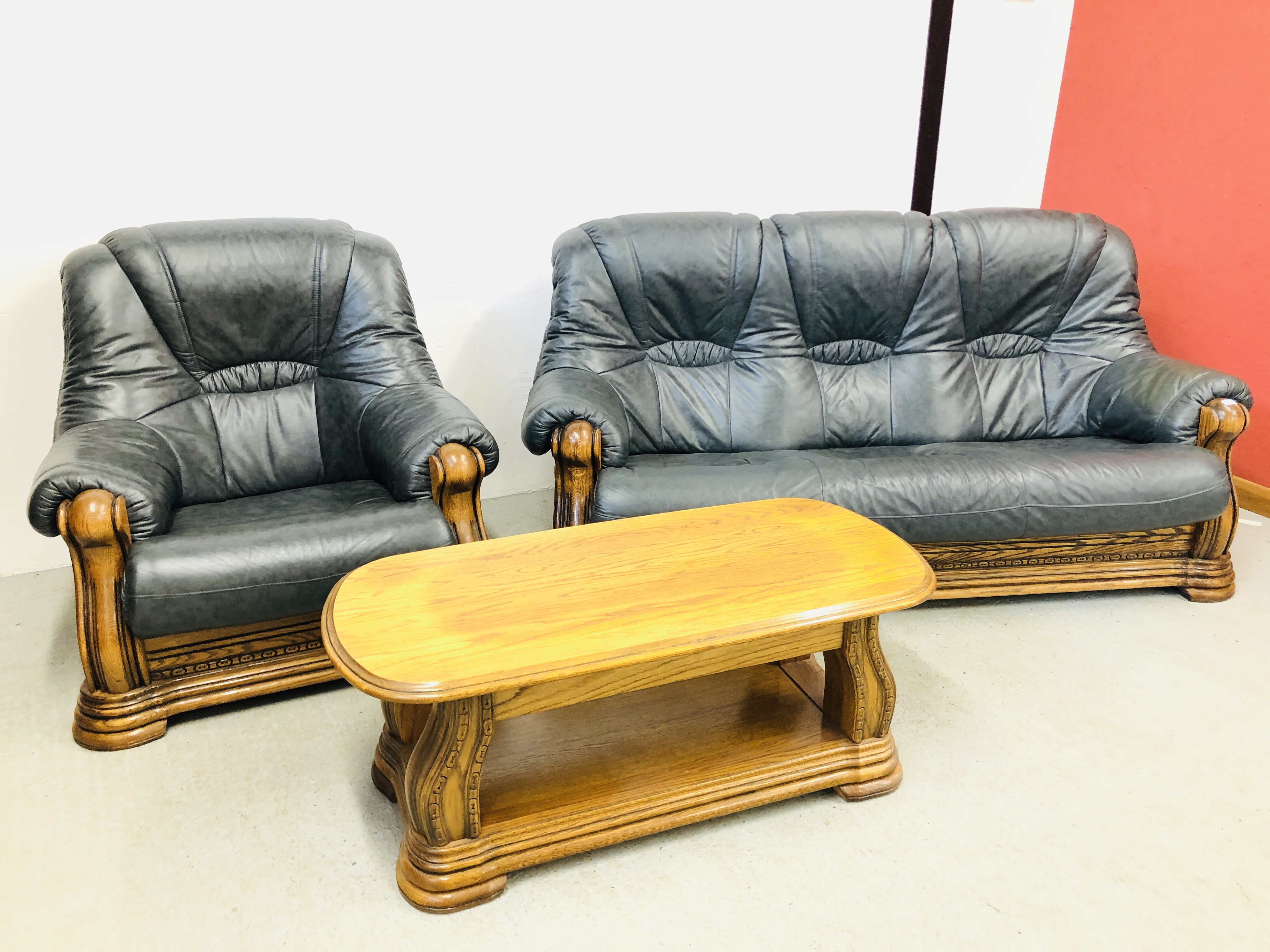 A NAVY BLUE 3 SEATER SOFA AND ARM CHAIR WITH CARVED WOOD SURROUND AND MATCHING OAK COFFEE TABLE - Image 2 of 13