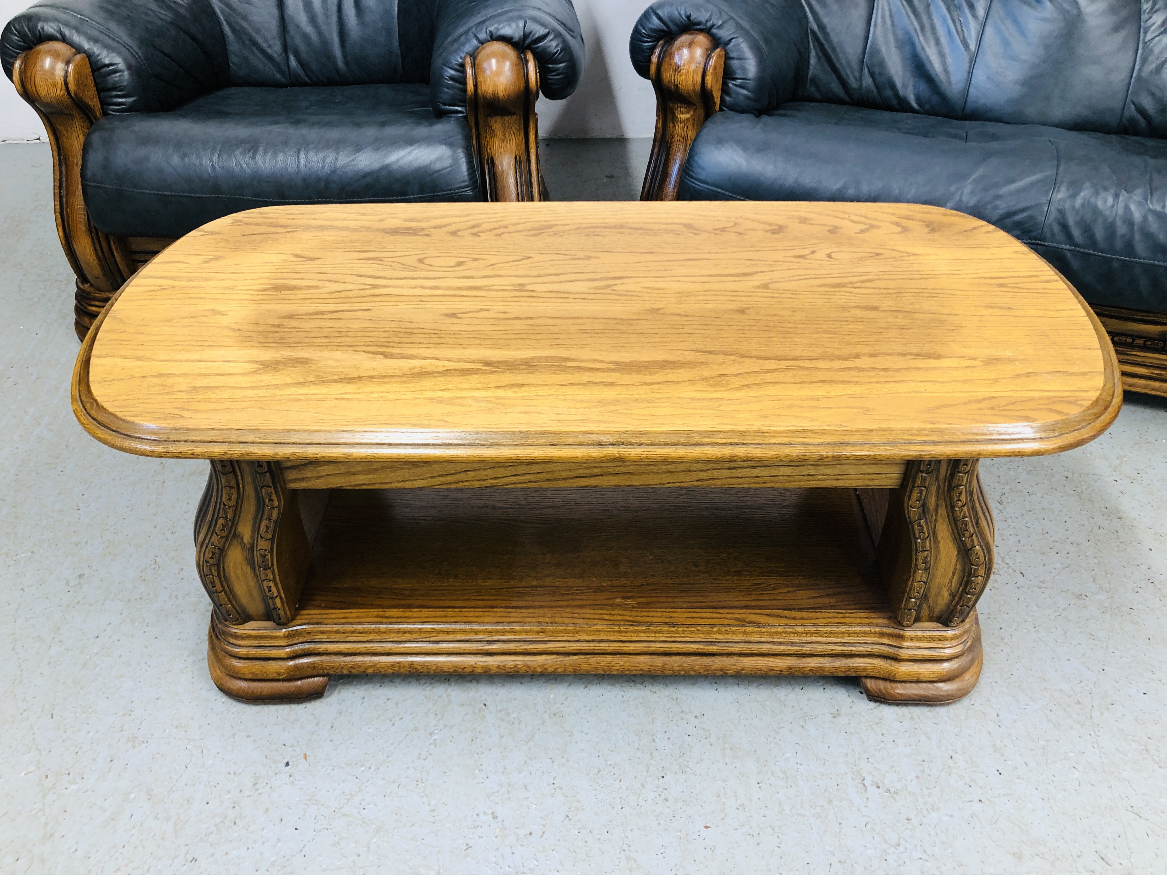 A NAVY BLUE 3 SEATER SOFA AND ARM CHAIR WITH CARVED WOOD SURROUND AND MATCHING OAK COFFEE TABLE - Image 12 of 13