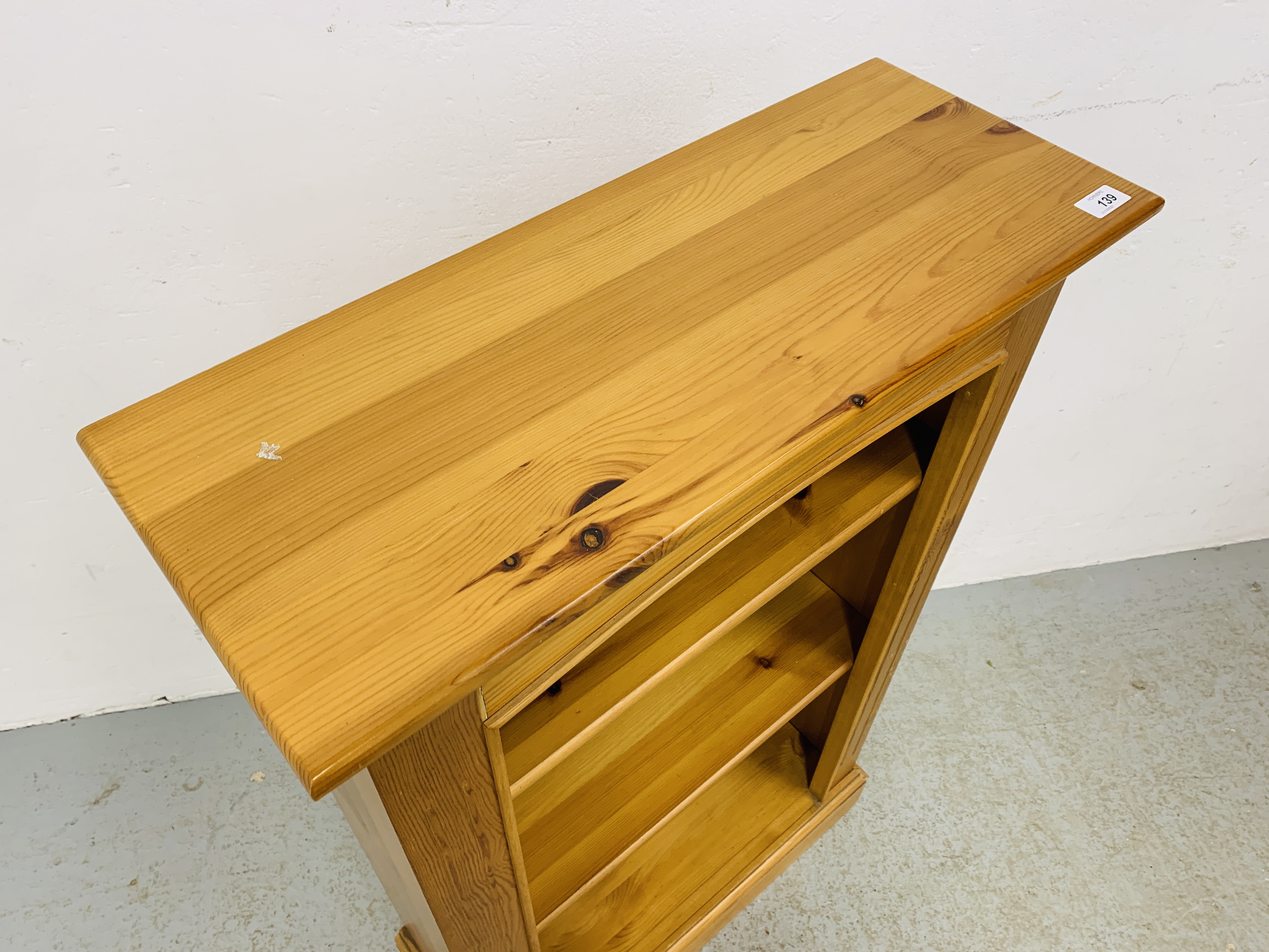A SOLID HONEY PINE BOOKSHELF WITH TONGUE AND GROOVE BOARDED BACK - W 66CM. D 26CM. H 107CM. - Image 8 of 8