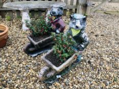 A PAIR OF STONEWORK BADGES WITH WHEEL BARROW PLANTERS, H 50CM,