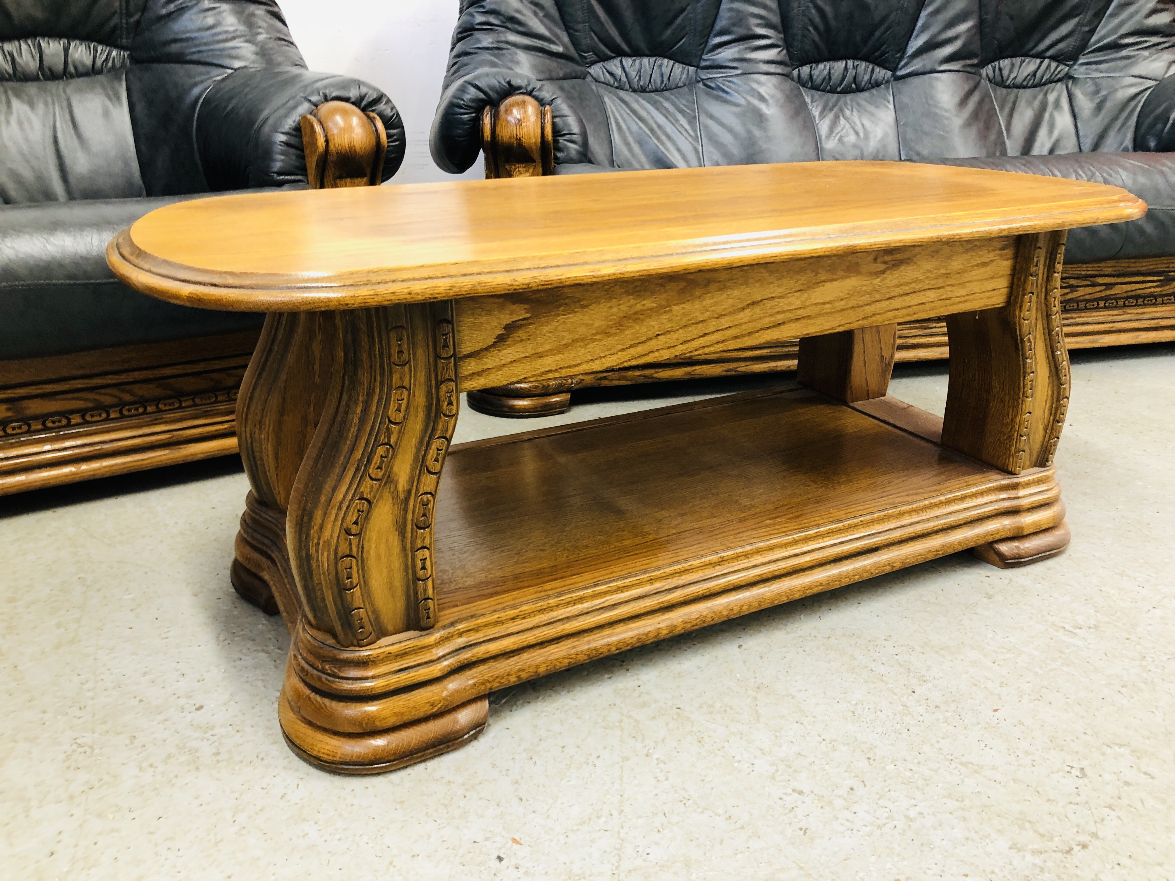 A NAVY BLUE 3 SEATER SOFA AND ARM CHAIR WITH CARVED WOOD SURROUND AND MATCHING OAK COFFEE TABLE - Image 3 of 13