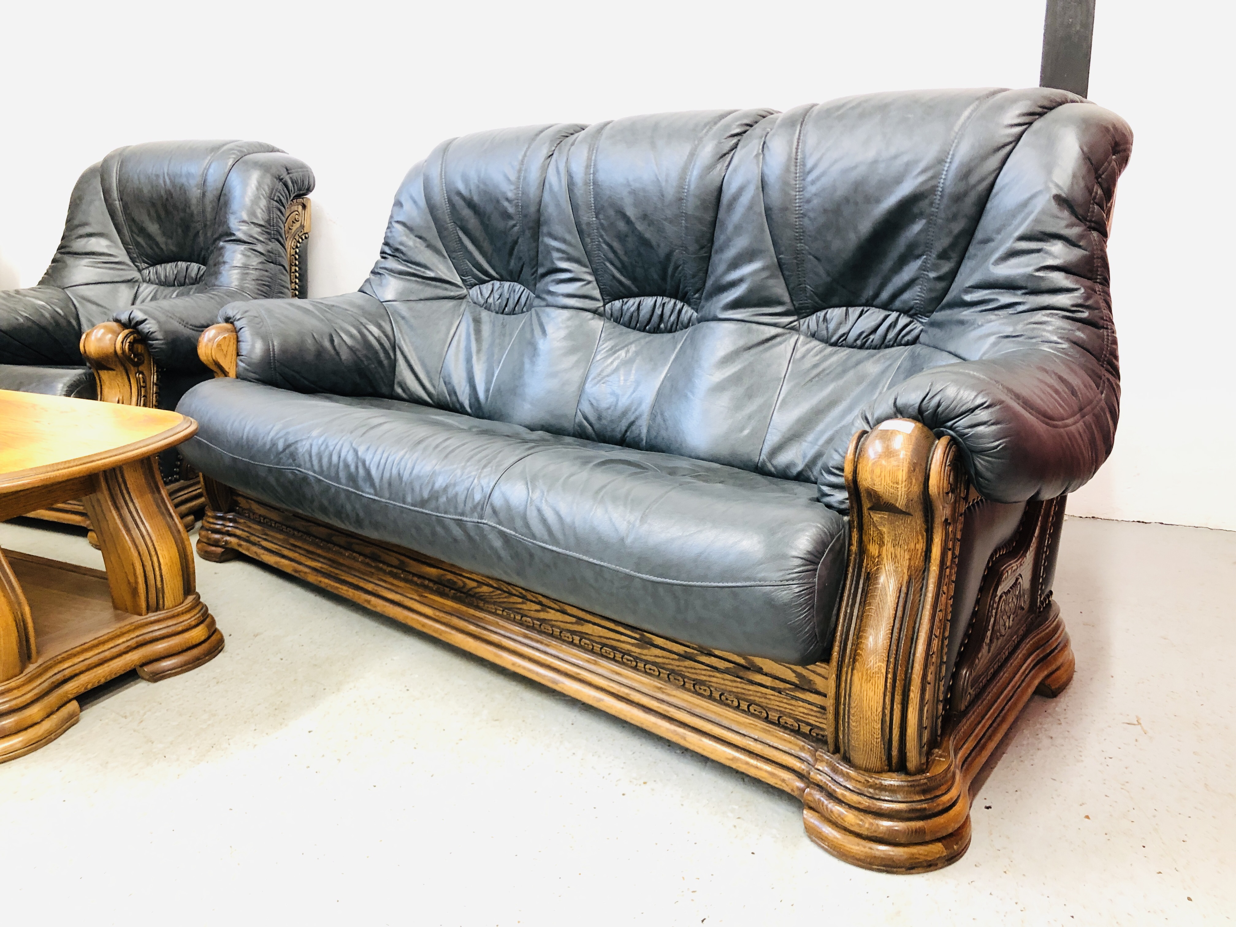 A NAVY BLUE 3 SEATER SOFA AND ARM CHAIR WITH CARVED WOOD SURROUND AND MATCHING OAK COFFEE TABLE - Image 5 of 13
