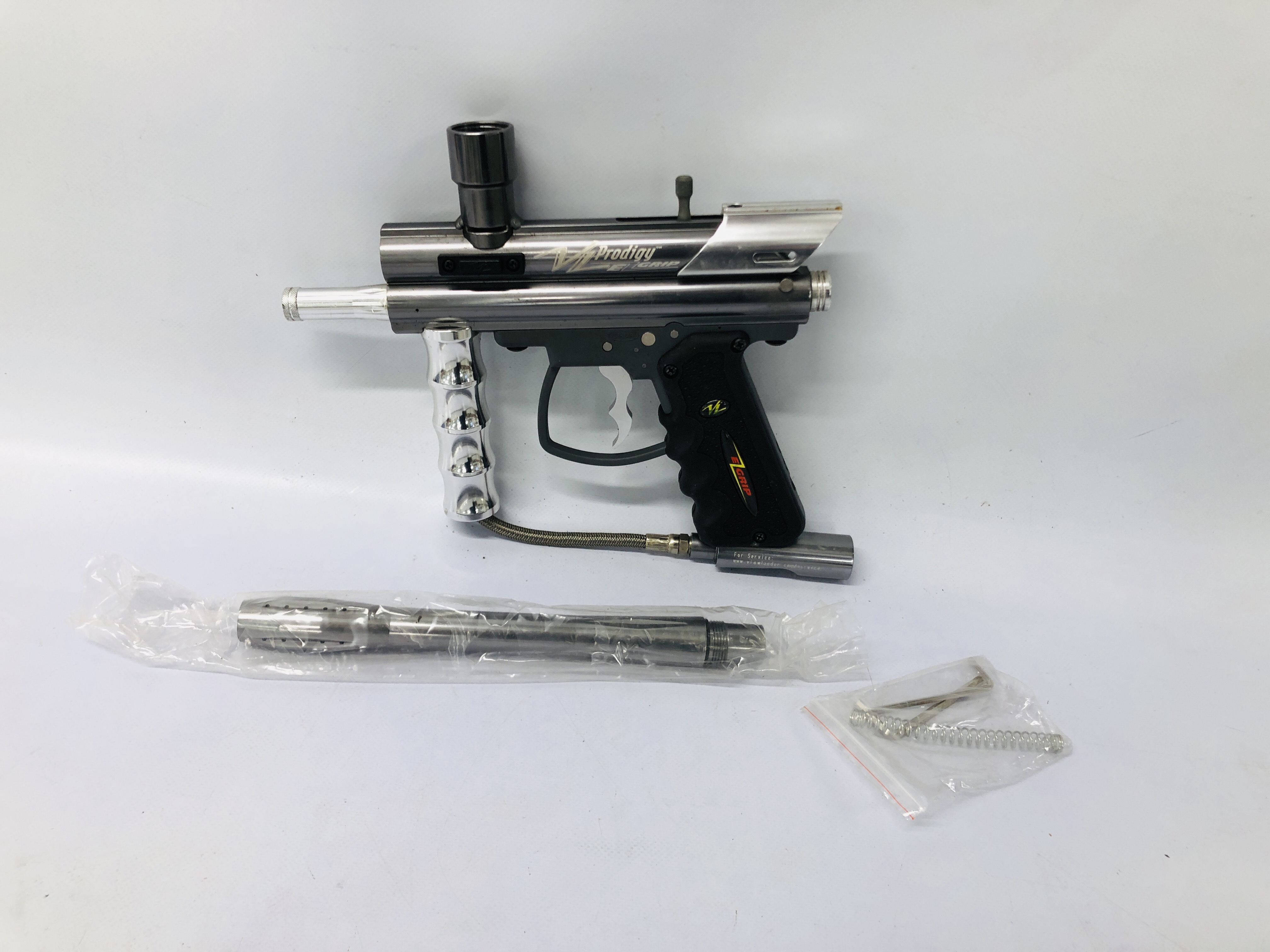 A PRODIGY VLE GRIP PAINTBALL GUN AS NEW