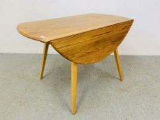 AN ERCOL BLONDE DROP FLAP DINING TABLE - LENGTH 113CM. WIDTH 63CM. (EXTENDED 127CM.