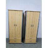 A PAIR OF MODERN BEECHWOOD FINISH DOUBLE WARDROBES WITH DRAWERS TO BASE - EACH W 74CM. D 50CM.