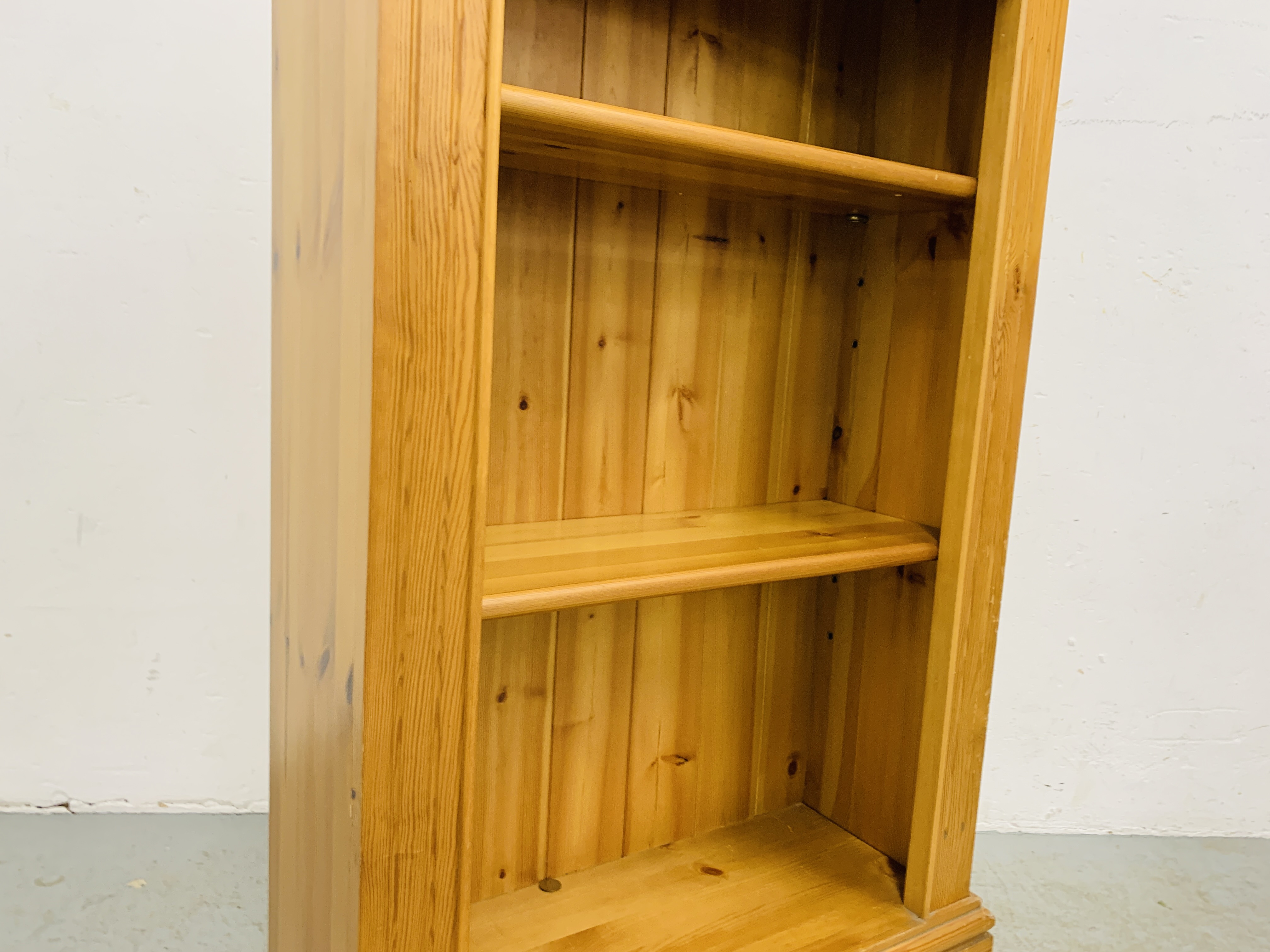 A SOLID HONEY PINE BOOKSHELF WITH TONGUE AND GROOVE BOARDED BACK - W 66CM. D 26CM. H 107CM. - Image 4 of 8