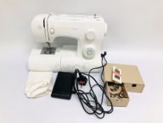 A MODERN SINGER TALENT SEWING MACHINE COMPLETE WITH FOOT PEDAL AND ACCESSORIES WITH SOFT COVER -