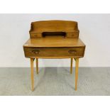 AN ERCOL WINDSOR ELM WRITING DESK - W 69CM. D 45CM. H 95CM.