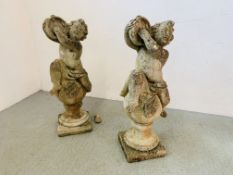 A PAIR OF GARDEN STONEWORK FEATURES DEPICTING CHERUBS WITH TAMBOURINES RESTING ON SPHERES - ONE A/F