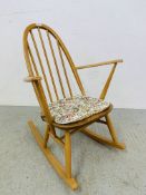 AN ERCOL BLONDE ROCKING CHAIR (SMALL)