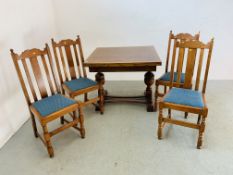 A 1940'S OAK DRAWER LEAF DINING TABLE WITH BULBOUS SUPPORTS ALONG WITH A SET OF FOUR OAK SLAT BACK