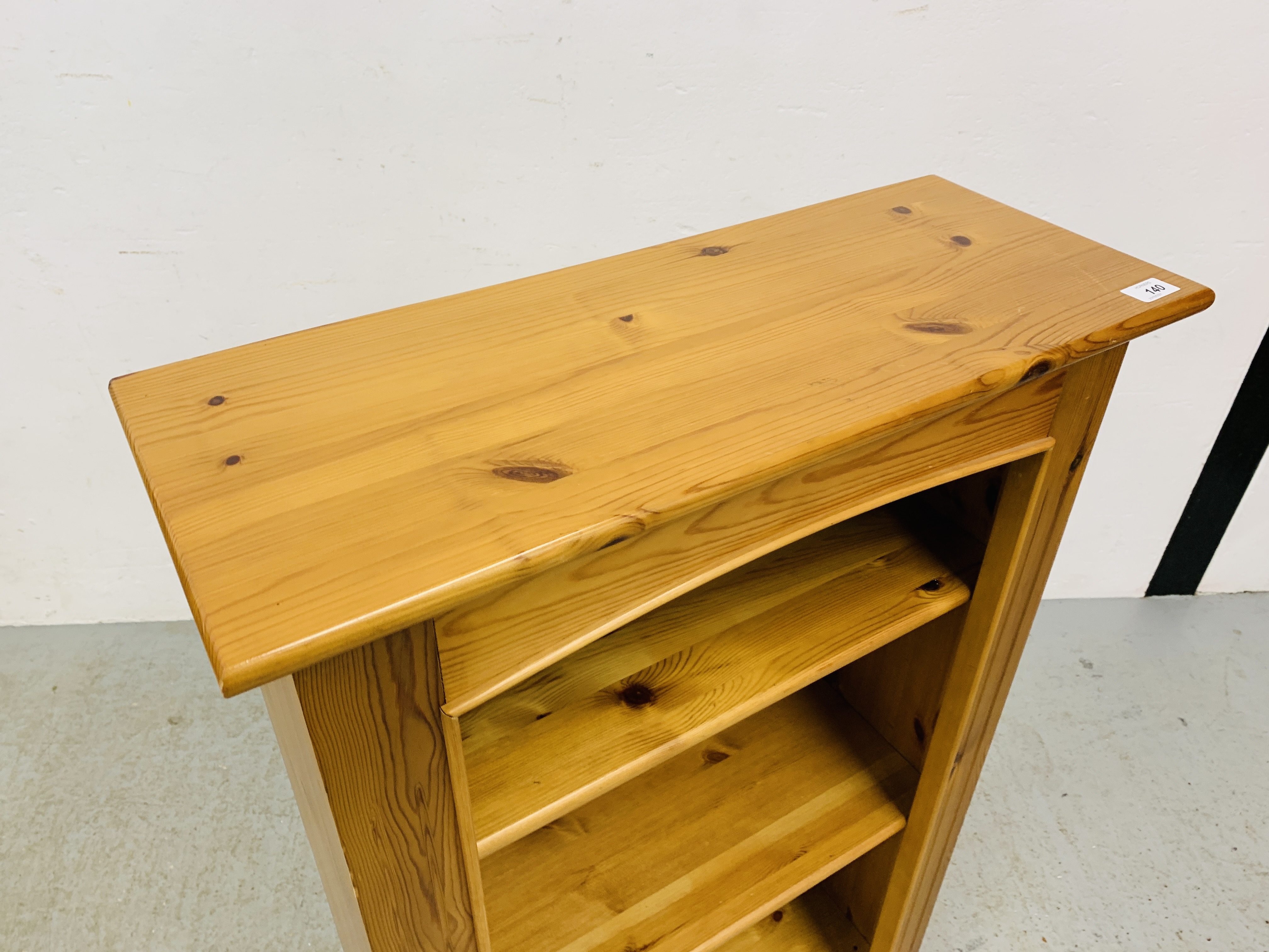 A SOLID HONEY PINE BOOKSHELF WITH TONGUE AND GROOVE BOARDED BACK - W 66CM. D 26CM. H 107CM. - Image 2 of 5