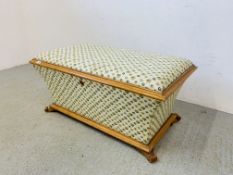 A VICTORIAN SATINWOOD WAISTED OTTOMAN WITH GREEN IVY LEAF UPHOLSTERY A/F CONDITION, L 99CM, D 59CM,