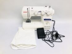 A MODERN JANOME DÉCOR EXCEL 25 SEWING MACHINE COMPLETE WITH PEDAL AND SOFT COVER - SOLD AS SEEN