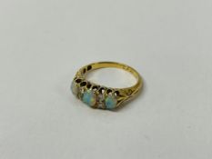 18CT GOLD THREE STONE OPAL RING,