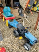 A CHILD'S PEDAL TRACTOR AND TRAILER ALONG WITH A LITTLE TIKES ROCKER AND PLAY TABLE